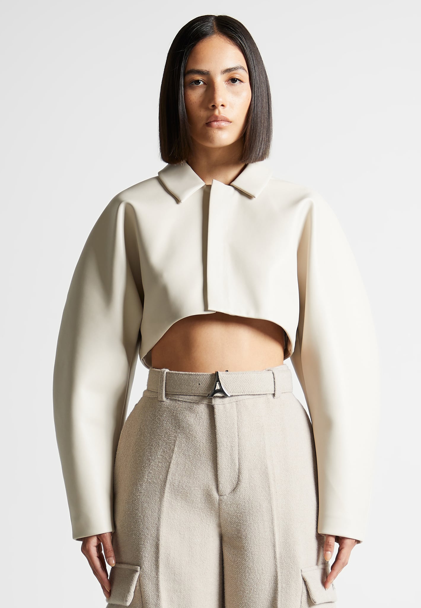 cream cropped jacket to wear over dress Tan and White Outfit Ideas