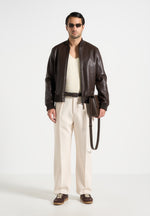 relaxed-fit-twill-pleated-tailored-trousers-cream