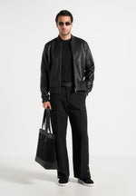 relaxed-fit-tailored-button-cuff-trousers-black