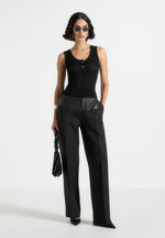 nora-pointelle-knitted-vest-with-knot-button-black