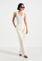 nora-pointelle-knitted-vest-with-knot-button-cream