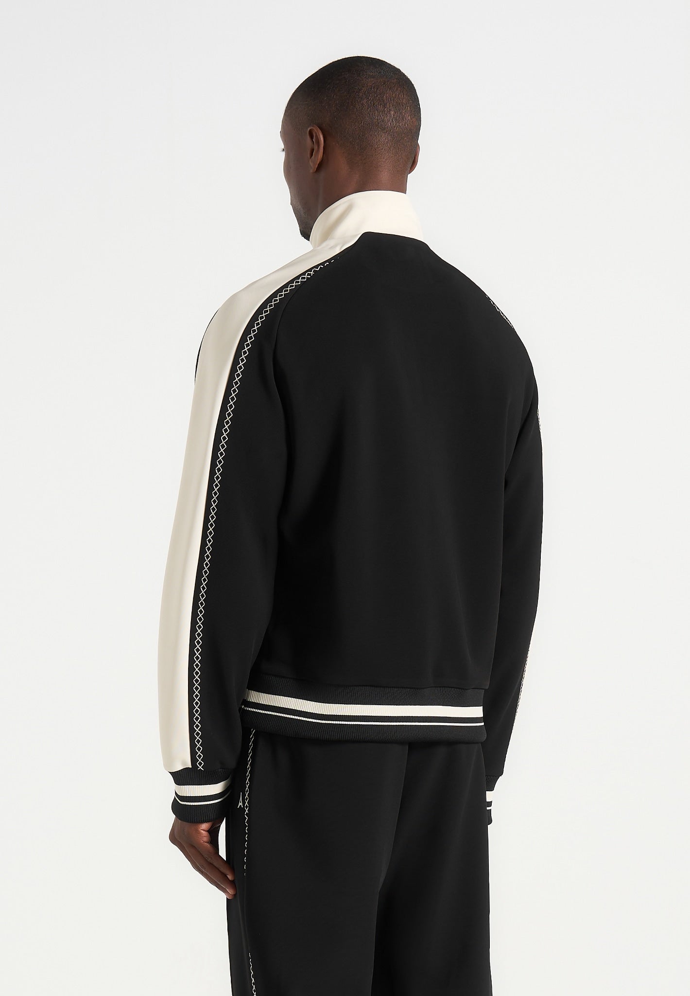 tristan-contrast-whipstitch-raglan-track-jacket-black