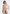 aurore-mock-neck-ring-belt-pleated-leg-jumpsuit-beige