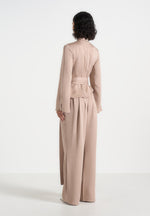 aurore-mock-neck-ring-belt-pleated-leg-jumpsuit-beige